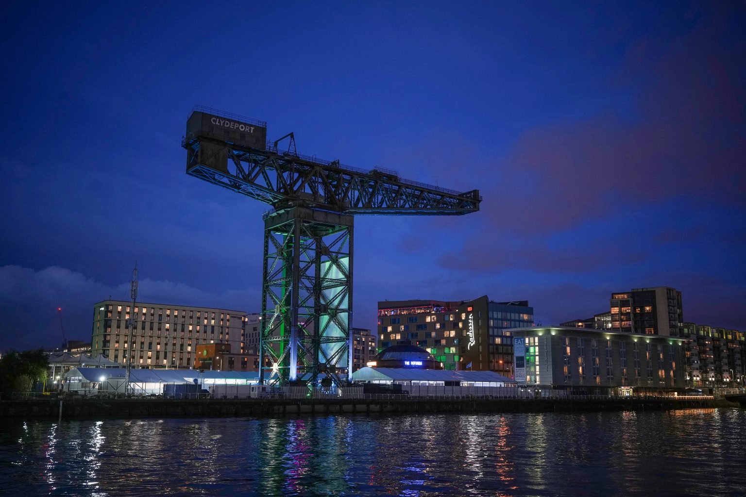GLASGOW, SCOTLAND - OCTOBER 29:  A general view of the Scottish Events Centre (SEC) and the Finnieston Crane at dusk as delegates from across the world begin to arrive for COP26 on October 29, 2021 in Glasgow, Scotland. (Photo by Christopher Furlong/Getty Images)
