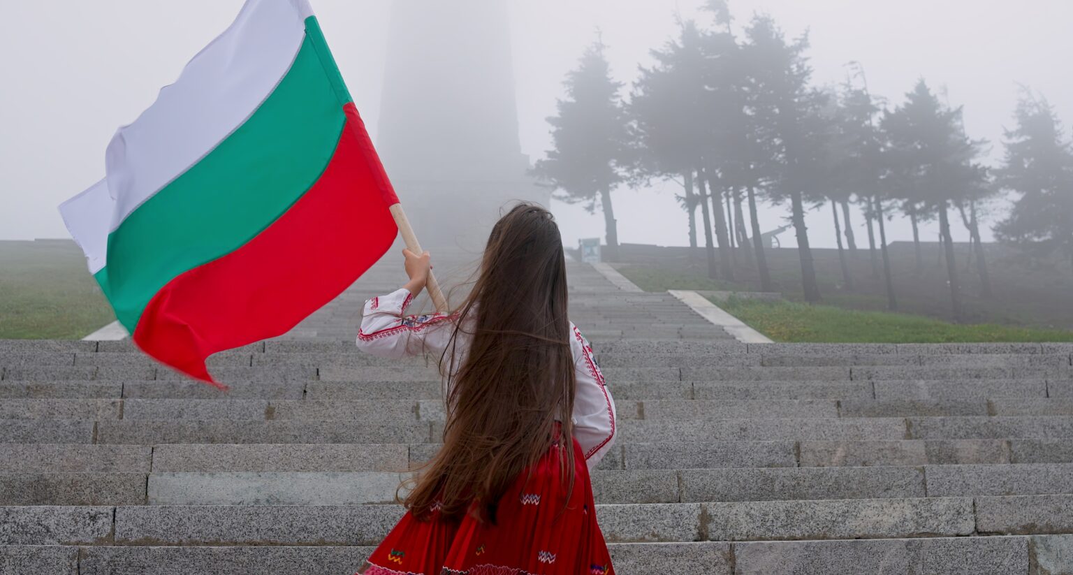 Woman,In,Ethnic,Folklore,Costume,With,Bulgarian,Flag,Climbing,Shipka