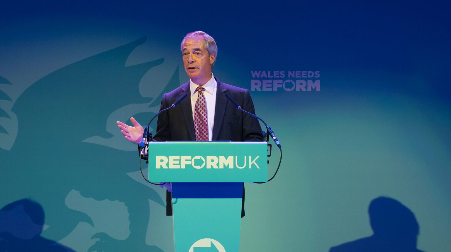 PORT TALBOT, WALES - JUNE 9: Leader of Reform UK Nigel Farage speaks at the Plaza on June 9, 2025 in Port Talbot, Wales. Reform UK Leader Nigel Farage is speaking to the press in Port Talbot following an announcement that Zia Yusuf would return to the party in a new role, shortly after he quit as party chairman last week. Yusuf will now head up Reform UK's "Doge team," based on US President Donald Trump's Department of Government Efficiency (DOGE). (Photo by Matthew Horwood/Getty Images)